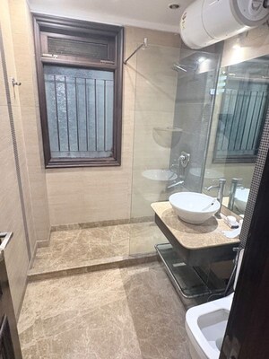 Bathroom in 4 BHK Builder Floor at Pamposh Enclave – for Rent