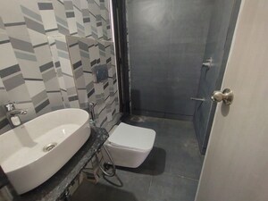 Bathroom in 1 BHK Apartment at Damji Shamji Mahavir Spring Tulip Phase 1, Pokhran Road No Two – for Rent