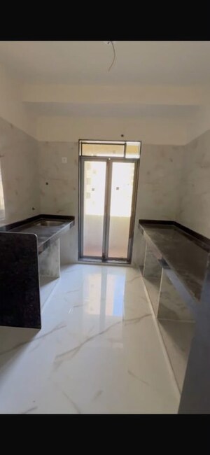 Kitchen in 2 BHK Apartment at Pushpanjali Heights, Owale – for Sale