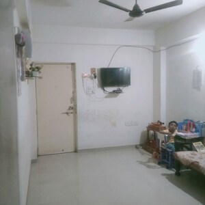 Living Room in 1 BHK Apartment at Taneshq Icon, Thergaon – for Rent