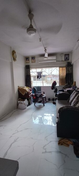 Living Room in 1 BHK Apartment at New Prem Nagar CHS, Borivali West – for Rent
