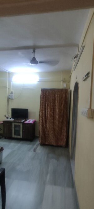 Living Room in 1 RK Apartment at Mohan Nagar CHS, Kandivali West – for Sale