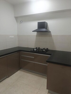 Kitchen in  Apartment at Geras World of Joy L, Kharadi – for Rent