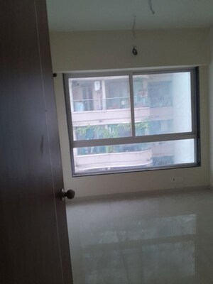 Room in 2 BHK Apartment at Triumph Omkareshwar CHS, Borivali East – for Sale
