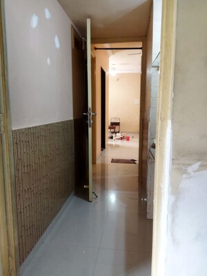 Building Lobby in 2 BHK Apartment at Tharwani Heritage, Kharghar Sector 7 – for Rent