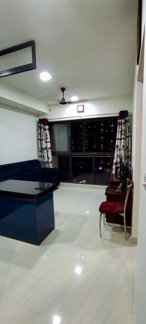 Living Room in 1 BHK Apartment at Lodha Crown Quality Homes, Majiwada – for Rent