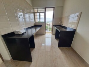 Kitchen in 2 BHK Apartment at Tirupati Campus Phase 7, Dhanori – for Rent