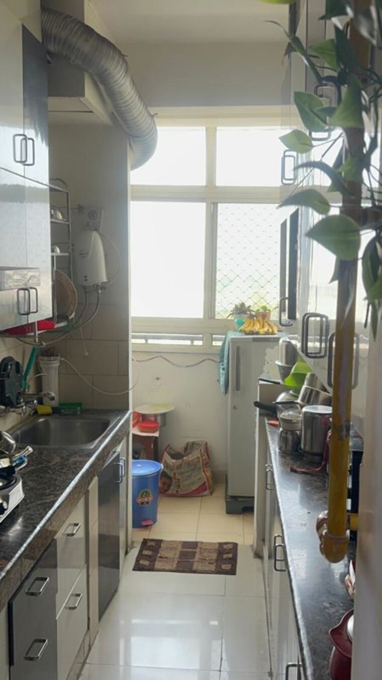 Kitchen, mahagun-mahagunpuram 2 Bedroom 900 Sq.Ft. Apartment In Shastri Nagar Ghaziabad 10542573