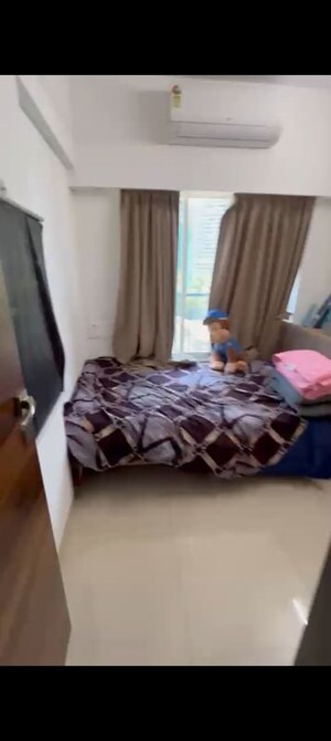 Bedroom in 2 BHK Apartment at Ruparel Sky Green, Kandivali West – for Rent