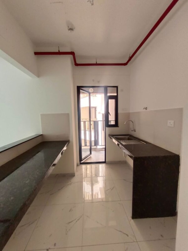 Kitchen, mahindra-nestalgia 2 Bedroom 1000 Sq.Ft. Apartment In Pimpri Pune 10542799