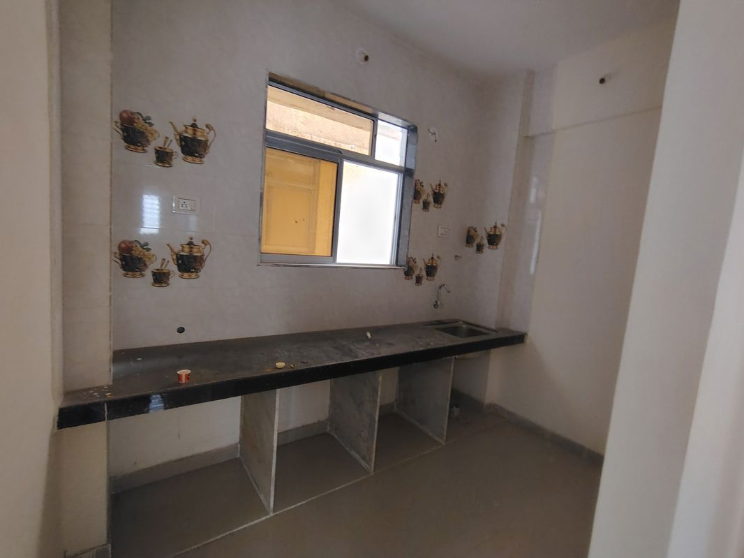 Kitchen in 1 BHK Apartment at Hari Om Swapna Nagari, Kasheli – for Sale