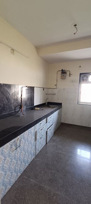 Kitchen in 3 BHK Apartment at Kalpataru Hills Phase II, Manpada – for Rent