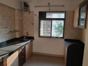 Kitchen in 2 BHK Apartment at Rutu Enclave, Kasarvadavali – for Rent