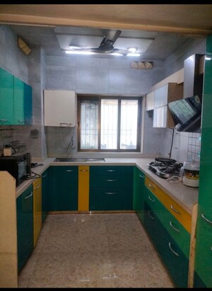Kitchen in 4 BHK Apartment at Veernav Ram Niwas, Gokhale Road – for Rent