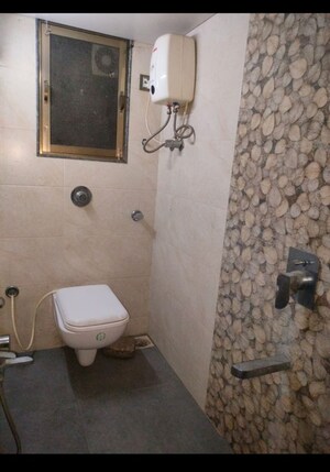 Bathroom in 4 BHK Apartment at Veernav Ram Niwas, Gokhale Road – for Rent