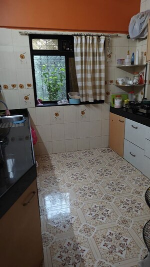 Kitchen in 2 BHK Apartment at Express Apartment, Yari Road – for Rent
