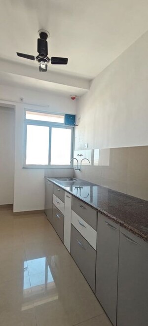 Kitchen in 2 BHK Apartment at Puranik City Reserva, Ghodbunder Road – for Rent