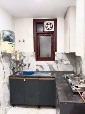 Kitchen in 2 BHK Apartment at Khirki Extension – for Rent