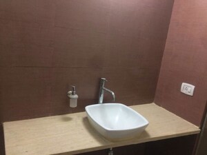 Bathroom in 2.5 BHK Apartment at Mahagun Moderne, Sector 78 – for Sale