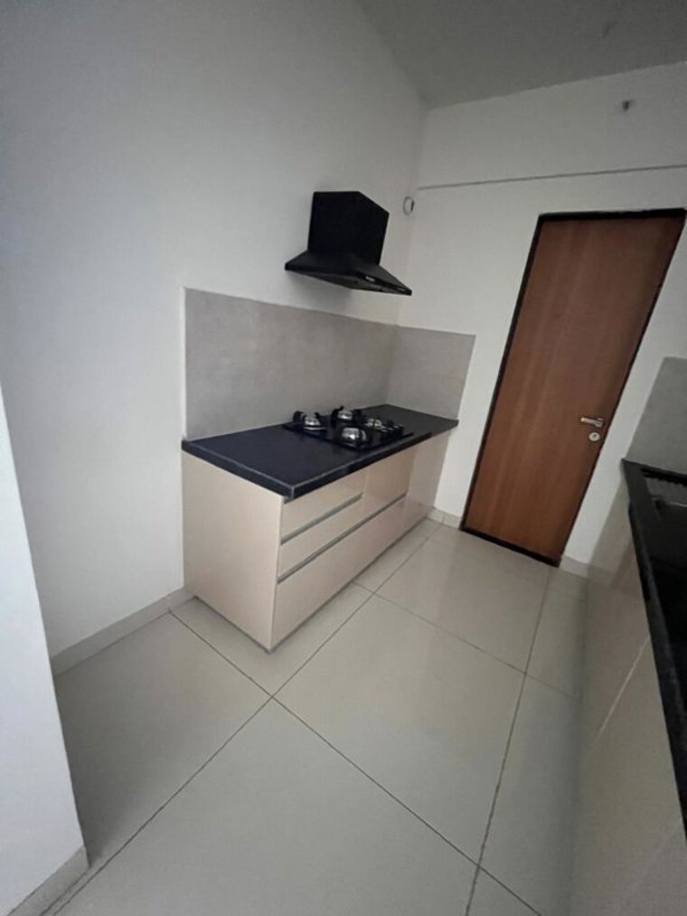 Kitchen, gera-world-of-joy 3 Bedroom 1120 Sq.Ft. Apartment In Kharadi Pune 10546693