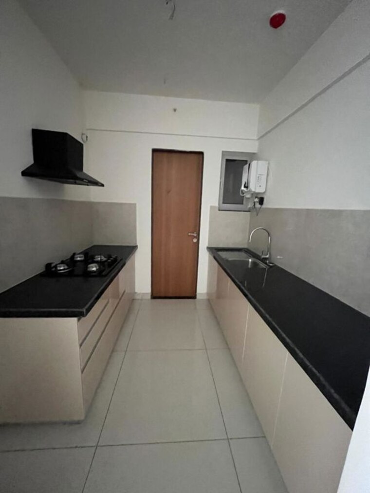 Kitchen, gera-world-of-joy 3 Bedroom 1120 Sq.Ft. Apartment In Kharadi Pune 10546693