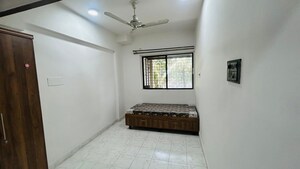 Bedroom in 2 BHK Apartment at Sunflower Apartment CHS, Kondhwa – for Rent