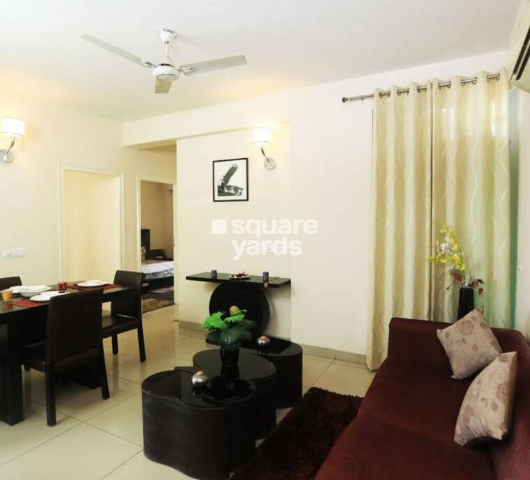 Living Room, wave-executive-floors 2 Bedroom 900 Sq.Ft. Apartment In Wave City Ghaziabad 10547124