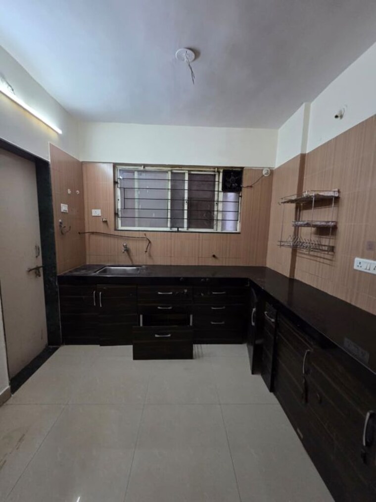 Kitchen, nirmiti-lorelle 3 Bedroom 1200 Sq.Ft. Apartment In Wakad Pune 10547522