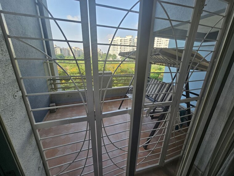 Balcony, aishwaryam-greens-co-operative-housing-society 3 Bedroom 1200 Sq.Ft. Apartment In Wakad Pune 10547559