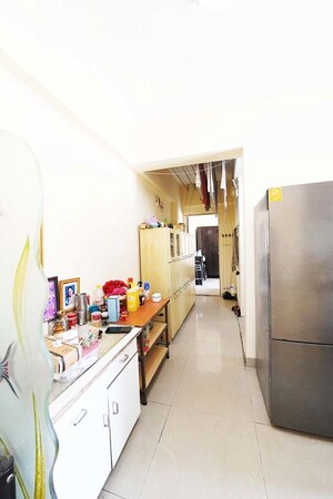 Kitchen in 1 BHK Apartment at Surya Vaibhav, Thergaon – for Sale