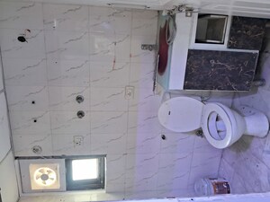 Bathroom in 2 BHK Apartment at Charms Castle, Raj Nagar Extension – for Rent