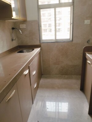 Kitchen in 1 BHK Apartment at RNA NG Aroma, Mira Road East – for Sale