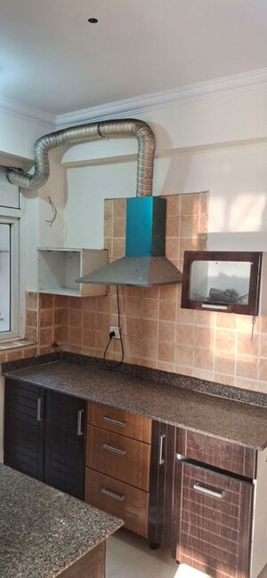 Kitchen in 2 BHK Apartment at Amrapali Eden Park, Sector 50 – for Rent