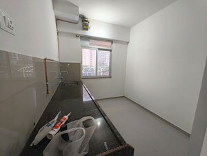 Kitchen in 1 BHK Apartment at Metropolis Bayside, Kasarvadavali – for Rent
