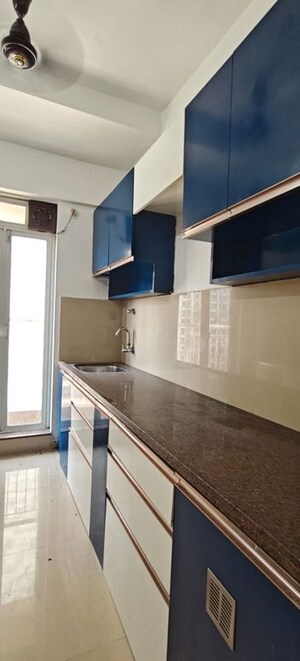 Kitchen in 2 BHK Apartment at Godrej Emerald, Ghodbunder Road – for Rent