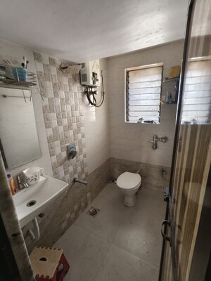 Bathroom in 1 BHK Apartment at Puranik City, Kasarvadavali – for Rent