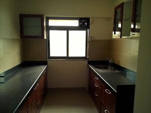 Kitchen in 2 BHK Apartment at Cosmos Jewels, Ghodbunder Road – for Rent