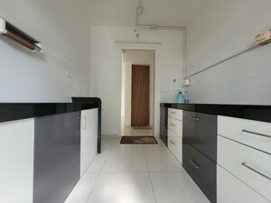 Kitchen in 3 BHK Apartment at Godrej Emerald, Ghodbunder Road – for Rent