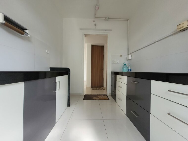 Kitchen, godrej-emerald 3 Bedroom 927 Sq.Ft. Apartment In Ghodbunder Road Thane 10549547