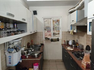 Kitchen in 2.5 BHK Apartment at Mahagun Moderne, Sector 78 – for Sale