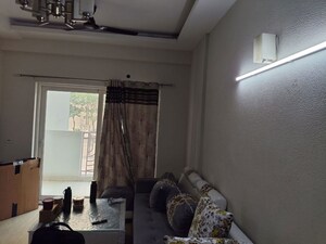 Living Room in 2.5 BHK Apartment at Mahagun Moderne, Sector 78 – for Sale