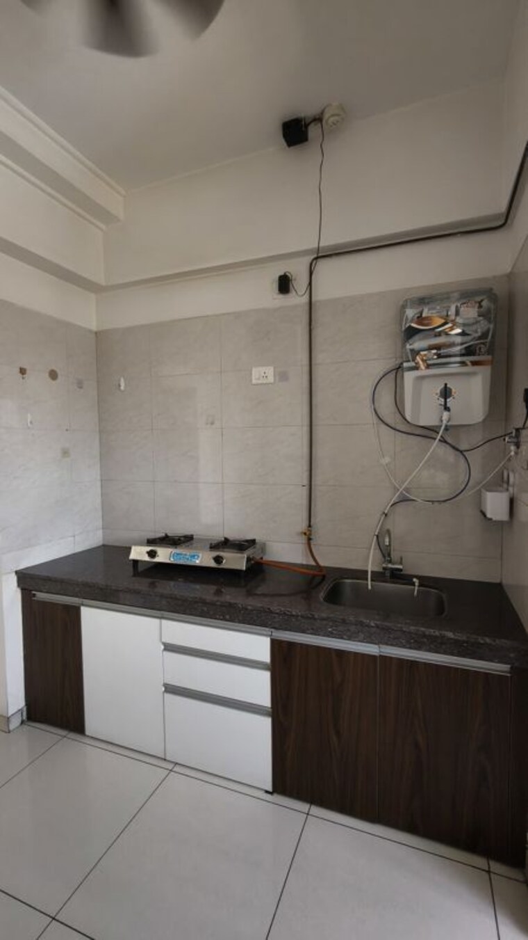Kitchen, gera-emerald-city 3 Bedroom 1560 Sq.Ft. Apartment In Kharadi Pune 10550334