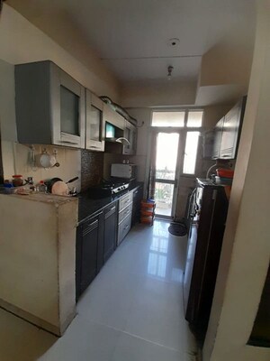 Kitchen in 2 BHK Apartment at Prateek Wisteria, Sector 77 – for Sale