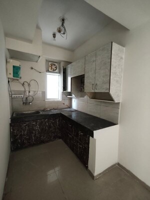 Kitchen in 2 BHK Apartment at Ajnara Homes, Sector 16b Greater Noida – for Rent