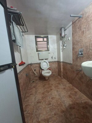 Bathroom in 2 BHK Apartment at Raj Ratna CHS, Borivali West – for Sale