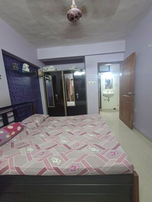 Bedroom in 2 BHK Apartment at Raj Ratna CHS, Borivali West – for Sale