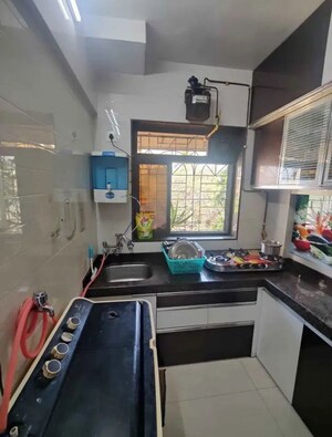 Kitchen in 1 BHK Apartment at Ganesh Plaza CHS, Khanda Colony – for Sale