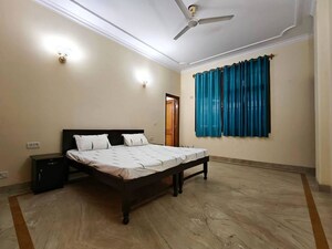Bedroom in 4 BHK Builder Floor at Sarvodaya Enclave – for Rent