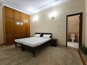 Bedroom in 4 BHK Builder Floor at Sarvodaya Enclave – for Rent