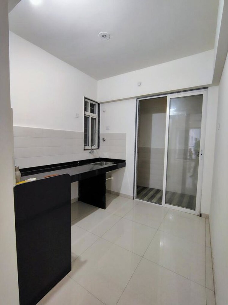 Kitchen, saheel-itrend-life 2 Bedroom 950 Sq.Ft. Apartment In Wakad Pune 10553447
